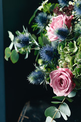 Winter bouquet next to candle