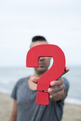 question mark in front of the face of a person