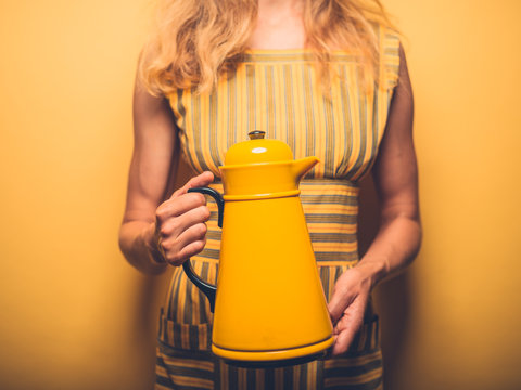 Young woman with big thermos