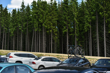 car parked on mountains parking with bicycles on roof 