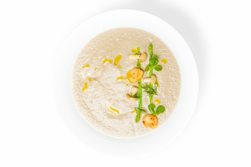 Cream mushroom soup with scallops and some herbs.