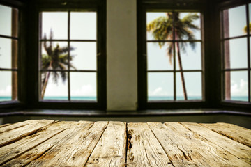 Table background of free space and window background with palms. Summer time. 