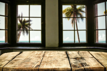 Table background of free space and window background with palms. Summer time. 