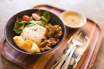 Close up Grilled pork satay on rice in the restaurant.