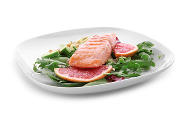 Plate with tasty grilled fish and vegetables on white background