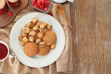Composition with tasty homemade cookies on wooden table