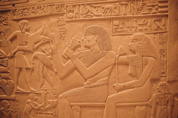 Egyptian Hieroglyphic carvings on the exterior walls of an ancient temple