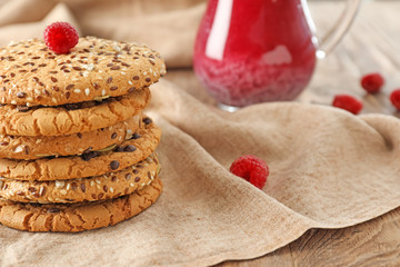 Stack of tasty cookies on table