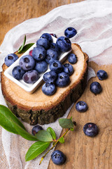 Fresh organic berries on a wooden background.
