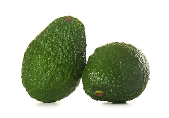 Fresh ripe avocados on white background
