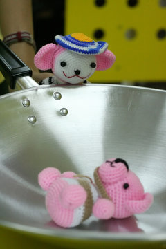 one crochet yarn doll see dead crocet yarn doll on a pan