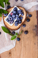 Fresh organic berries on a wooden background.