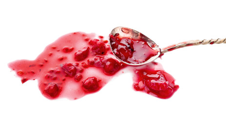 Spoon with sweet raspberry jam on white background