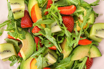 Plate with delicious healthy fresh salad, closeup