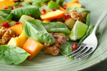 Delicious healthy fresh salad on plate, closeup