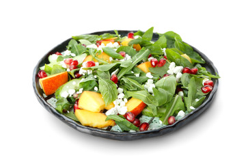 Plate with delicious healthy fresh salad on white background