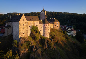 Aerial view on Loket Castle, Burg Elbogen, 12th-century Gothic style castle on a big rock, massive...