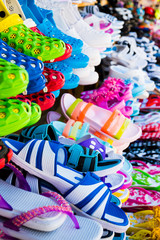 Fototapeta premium Beach shoes in the store. sandals on the beach