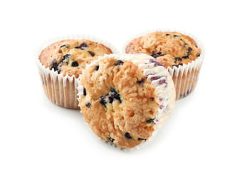 Sweet blueberry muffins on white background