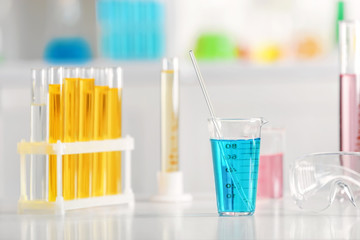 Chemical glassware on table in laboratory
