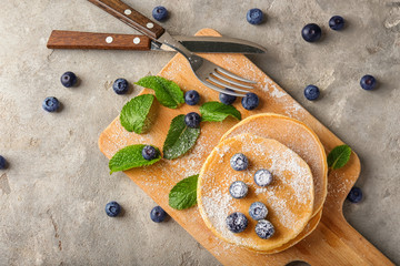 Composition with delicious pancakes on light table