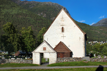 Fototapeta na wymiar Old stone church in Kinsarvik village, Hordaland county, Norway, originally built in 1050