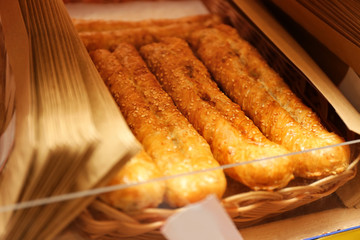 Fresh tasty bakery in wicker basket