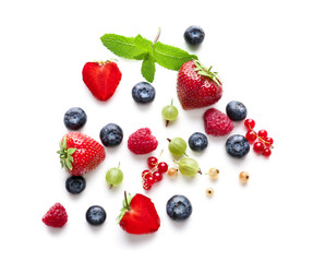 Delicious ripe berries on white background, top view
