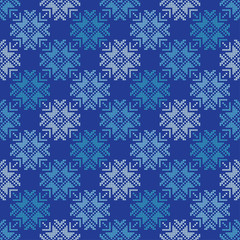 Cross stitch Norwegian snowflakes. Seamless vector background. Folk motives. Winter pattern. Textile rapport.