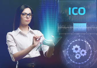 The concept of business, technology, the Internet and the network. A young entrepreneur working on a virtual screen of the future and sees the inscription: ICO