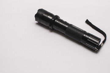 Flashlight, a black flashlight on white background