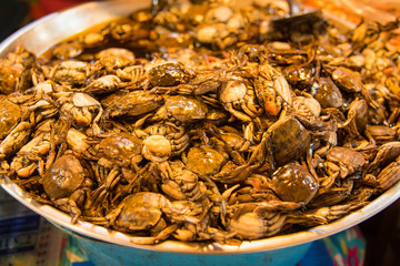 Salted crab in a basin sold in the market.Thailand.