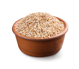 Barley grits in wooden bowl isolated on white