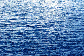 Fototapeta premium Sea blue water. Waves. Sea. River. The texture of the water. The ripples on the water.
