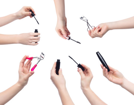 Set of hands with mascara and eyelash curlers
