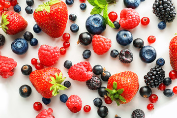 Delicious ripe berries on plate, closeup