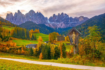Fototapeta premium Colorful autumn scenery in Santa Maddalena village at sunrise. Dolomite Alps, South Tyrol, Italy