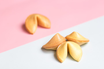 fortune cookie on pink and blue background, pastel colors