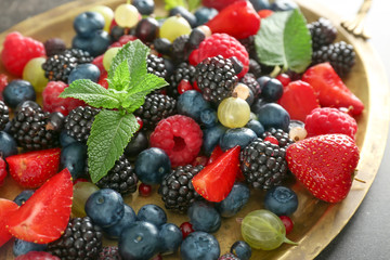 Assortment of fresh ripe berries on tray, closeup
