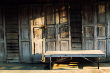 Fototapeta na wymiar table in front of wood house
