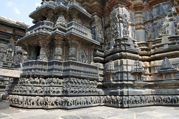 Fototapeta na wymiar Facade, decorative friezes with animal figures, and walls depicting Hindu deities. Chennakeshava temple. Belur, Karnataka. North West view.