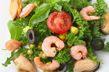 Tasty salad with shrimps and vegetables on plate, closeup