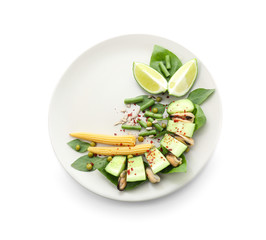 Tasty salad with mussels and vegetables on plate against white background