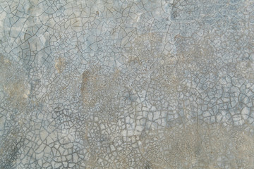 Grunge bare cracked concrete wall texture background. Material construction.