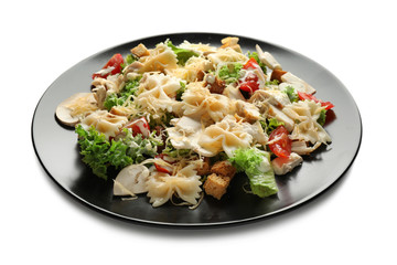 Tasty Caesar salad with pasta on white background