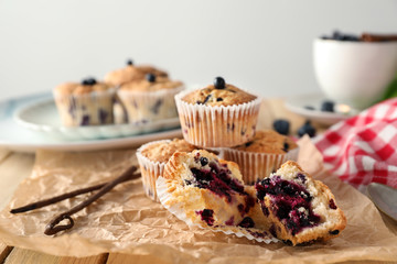 Tasty blueberry muffins on parchment