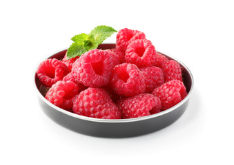 Plate with delicious fresh ripe raspberries on white background