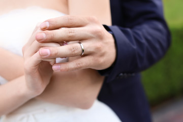 Happy wedding couple outdoors, closeup