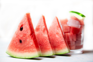  Juicy, ripe watermelon. Summer mood . Subject photography, food shooting. Pieces of watermelon with ice cubes.