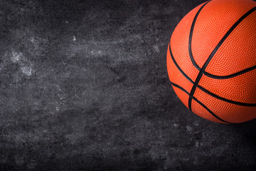 Basketball on black slate background. Copyspace.

